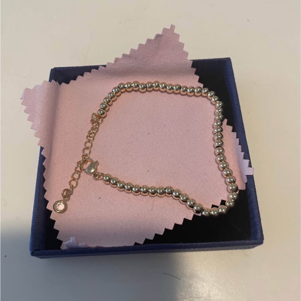 Elegant Gold Beaded Bracelet With Unique Clasp And Clear Crystal